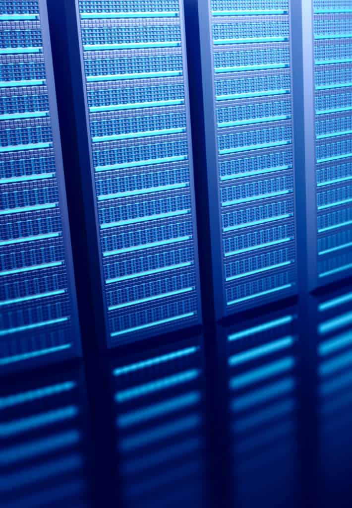 A generic wall of servers, there is a distinct blue glow to the image.